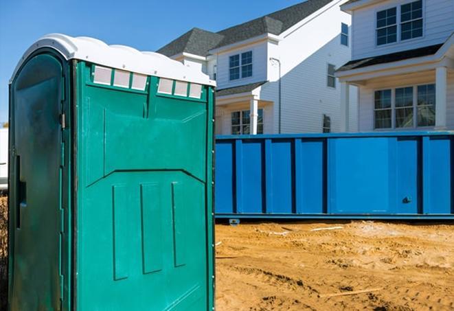 a sea of porta potties at a work site